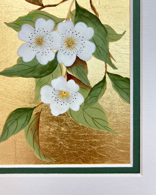 close up of botanical chinoiserie painting on gold leaf paper featuring white flowers on a branch