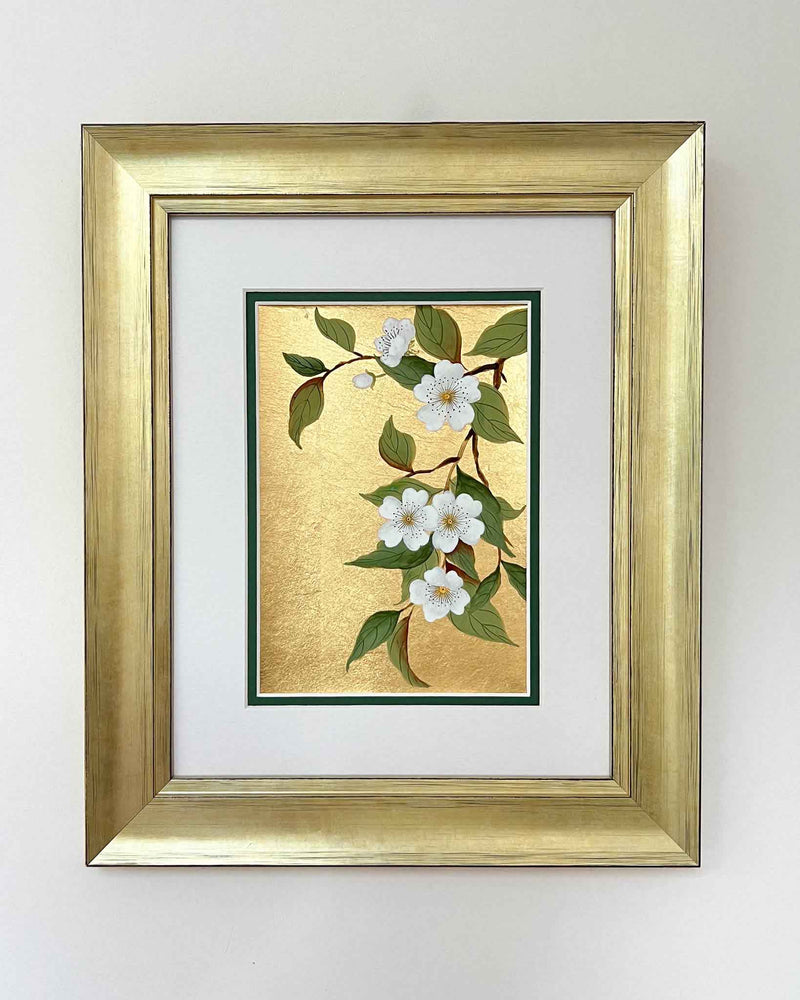 framed botanical chinoiserie painting on gold leaf paper featuring white flowers on a branch
