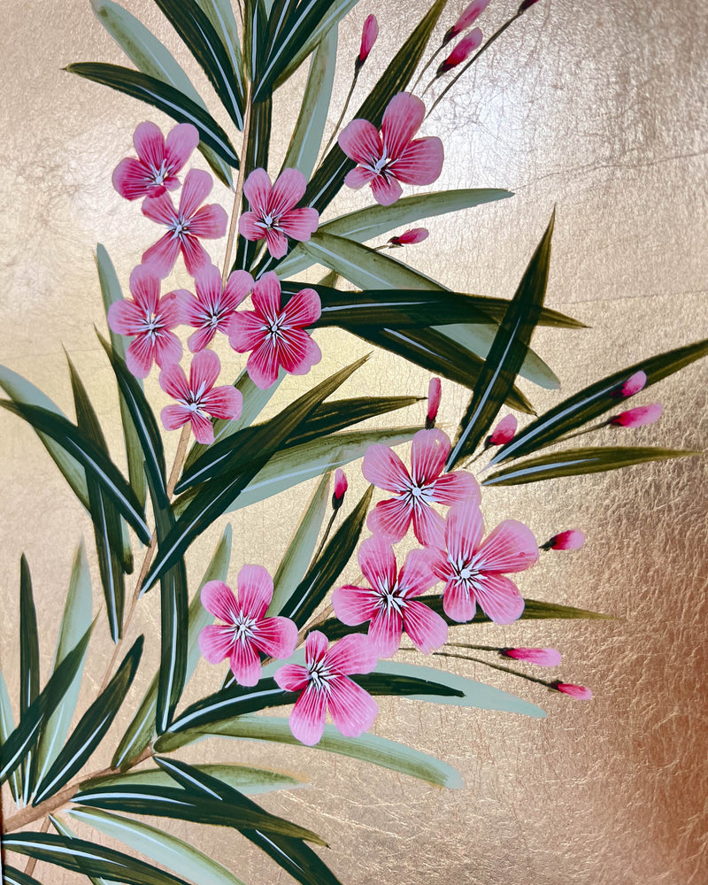 close up of floral chinoiserie painting on gold leaf paper featuring pink flowers and green leaves