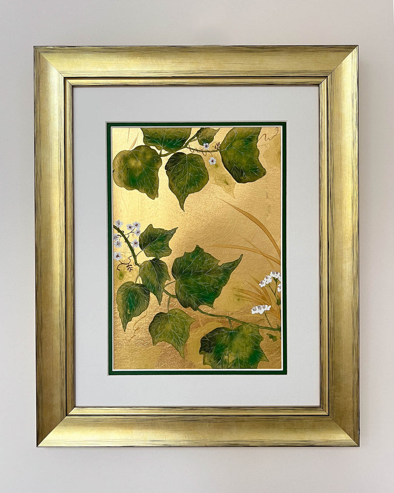 framed botanical chinoiserie painting on gold leaf paper featuring green vines with white flowers
