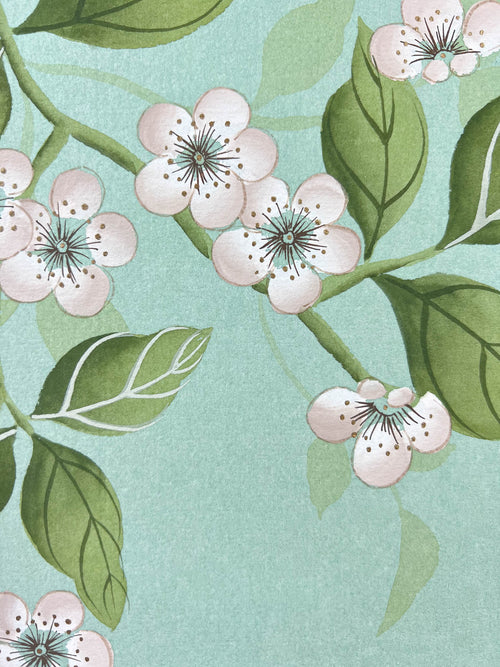 close up of blue chinoiserie painting on india tea paper featuring antique style flowers on branches