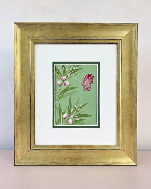 Diane Hill's original chinoiserie painting 'Emerald Butterfly And Flower Buds' in a gold frame on a plain white background