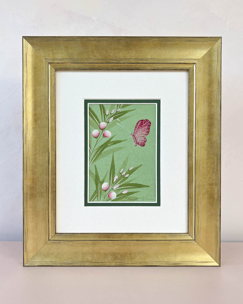 Diane Hill's original chinoiserie painting 'Emerald Butterfly And Flower Buds' in a gold frame on a plain white background