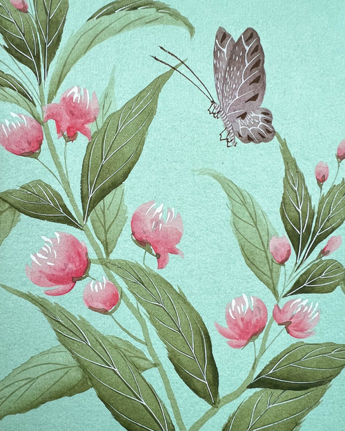 close up of blue chinoiserie painting on silk paper featuring vintage style butterfly, leaves and flowers