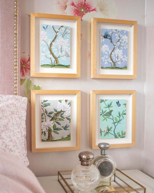 4 framed chinoiserie mini wall art prints in multi colours featuring botanical illustrations of birds, flowers, butterflies, and trees