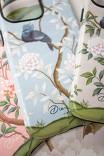 close up of 3 luxury chinoiserie phone cases with luxury vintage-style botanical designs featuring birds flowers and trees