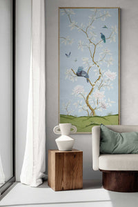 Blue botanical chinoiserie wall panel print with flowers and birds in Chinese painting style on wall