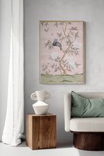 Pink botanical chinoiserie wall art print with flowers and birds in Chinese painting style on wall