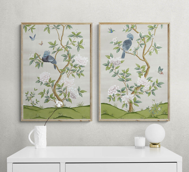 pair of two framed ivory and green botanical chinoiserie wall art prints with flowers and birds in Chinese painting style on wall
