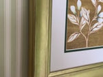 Video of framed gold chinoiserie botanical art print on bedroom wall