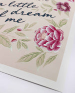 close up of pink vintage-style chinoiserie wall art print featuring flowers and leaves with the quote 'dream a little dream of me'
