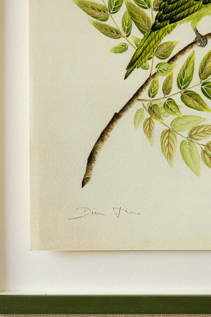 close up of botanical wall art print featuring gold sparkle embellished exotic bird on tree branch with flowers