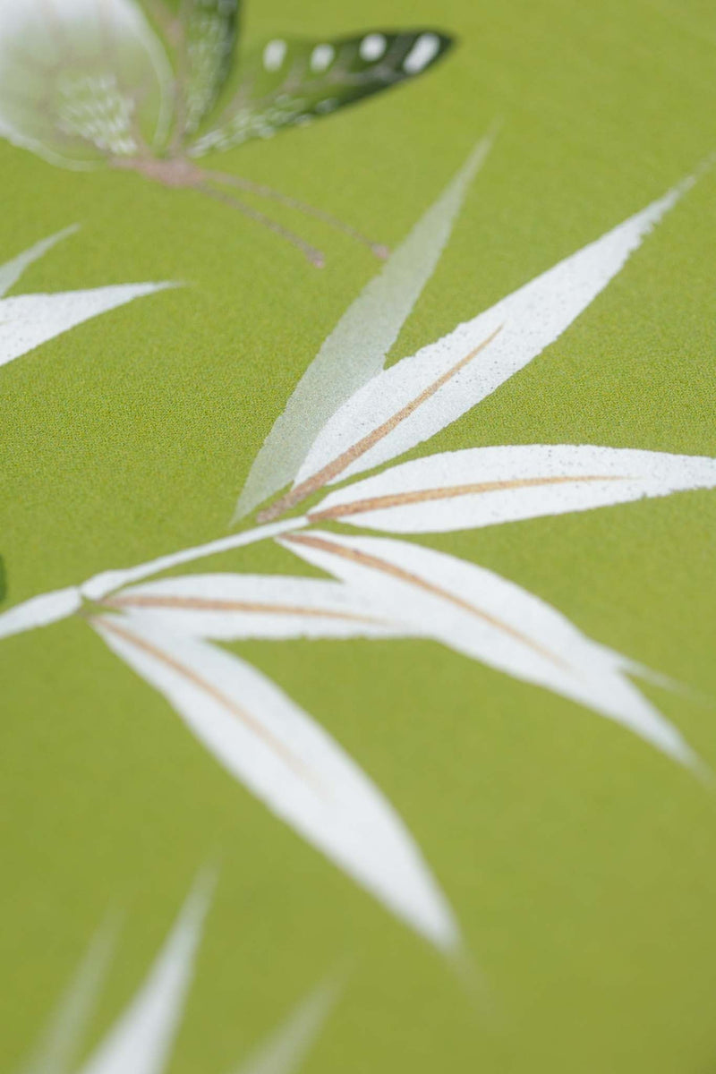 close up of green and white chinoiserie wall art print featuring bamboo a butterfly
