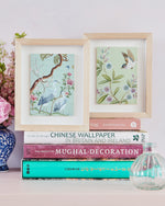 pair of 2 blue and green framed chinoiserie mini art prints featuring birds, flowers, and trees