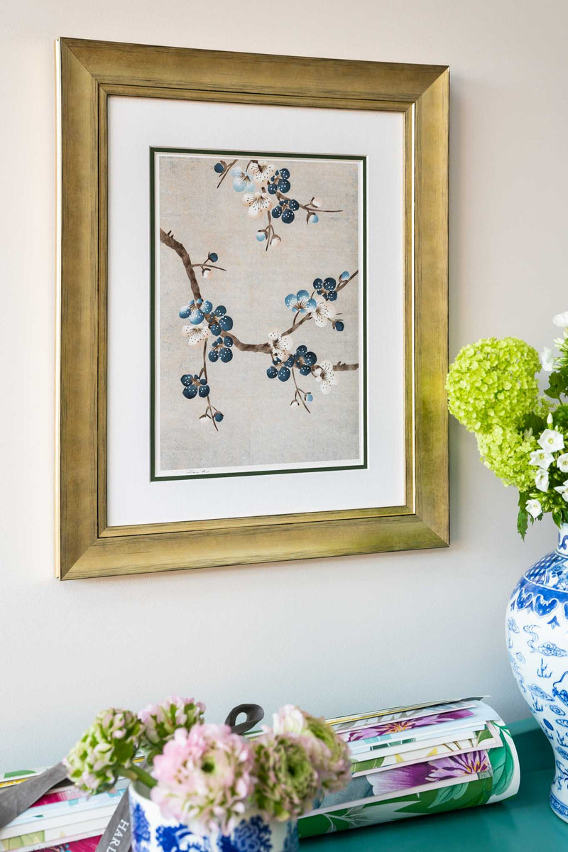 framed chinoiserie wall art print featuring Japanese-style cherry blossom branches on silver background hung on wall