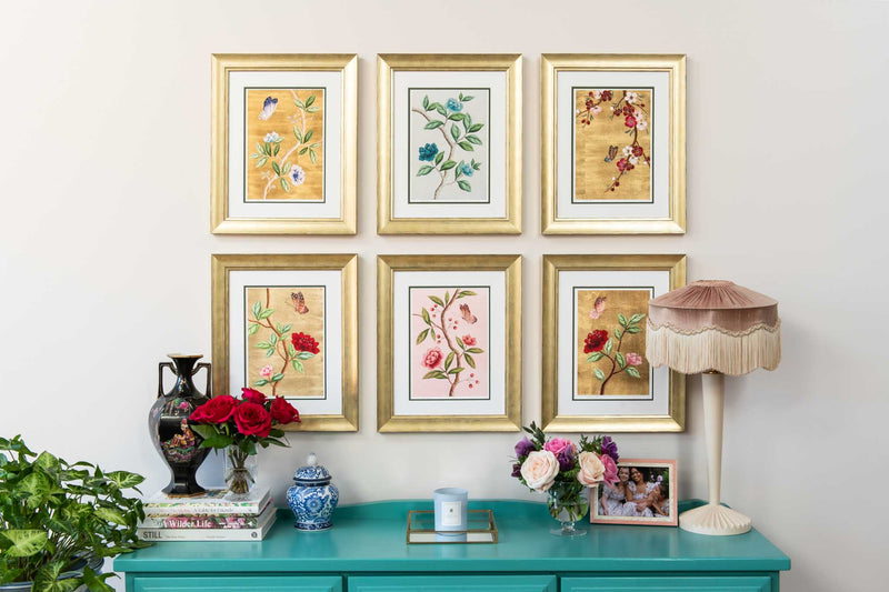 set of 6 colourful framed chinoiserie wall art print featuring vintage-style butterflies, blossoms, and flower branches displayed as gallery wall