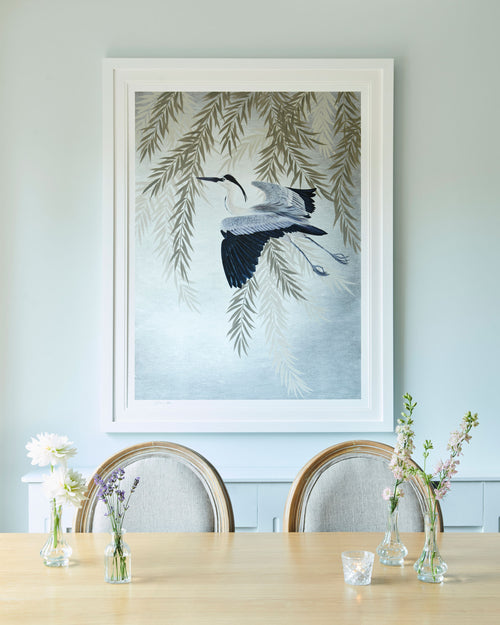 framed Japanese-style chinoiserie wall art print featuring heron and wisteria on silver background hung on wall