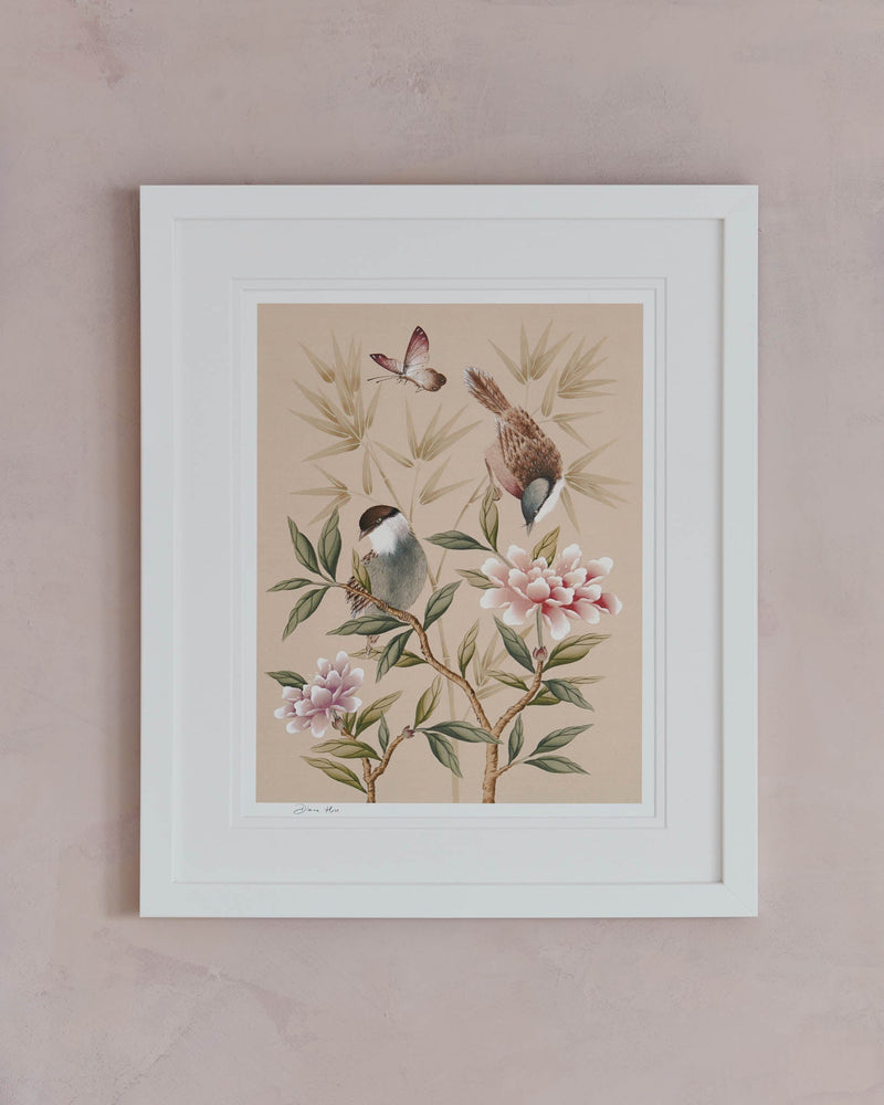blush pink framed chinoiserie wall art print featuring vintage style birds, butterfly and flower branches with a bamboo background