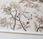 close up of neutral cream modern chinoiserie wall art print featuring two birds, flowers, branches, and fruit