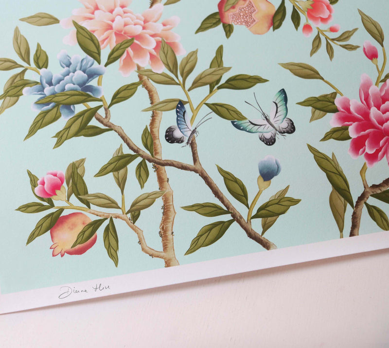 close up of blue modern chinoiserie wall art print featuring two birds, flowers, branches, and fruit on blue background 