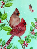close up of winter-themed chinoiserie art print featuring two cardinals and butterfly on a holly branch on green snowy background