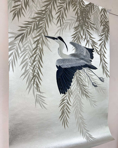 close up of Japanese-style chinoiserie painting featuring heron and wisteria on silver leaf background