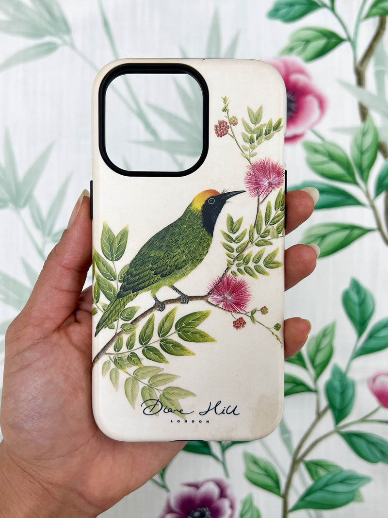 hand holding Luxury phone case featuring vintage style botanical bird on tree branch with flowers