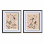 pair of blush pink framed chinoiserie wall art prints featuring vintage style birds, butterfly and flower branches with a bamboo background