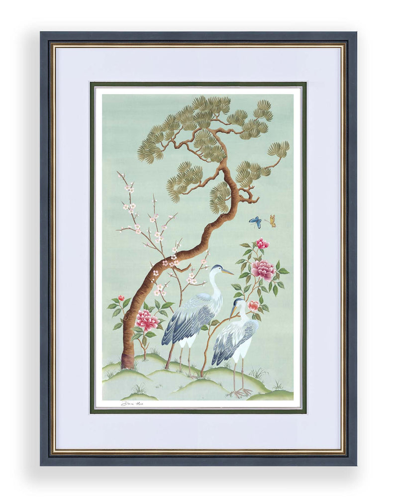 blue framed chinoiserie wall art print featuring antique inspired herons, flowers, and blossoms beneath a pine tree with butterflies