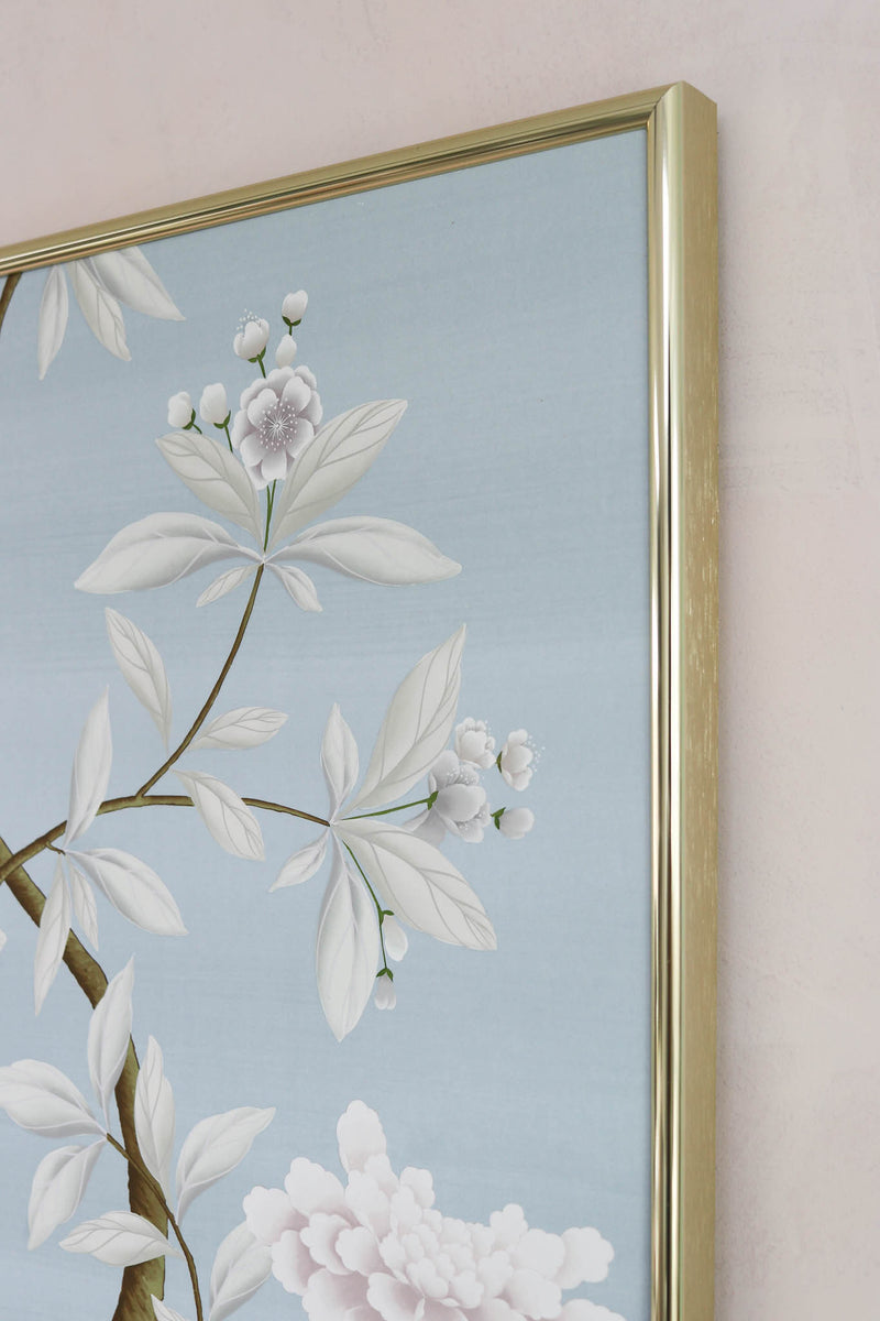 close up of framed blue chinoiserie art print 