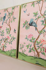 pair of 2 framed pink and green chinoiserie wall art prints with botanical illustrations featuring birds, butterflies, and flowers