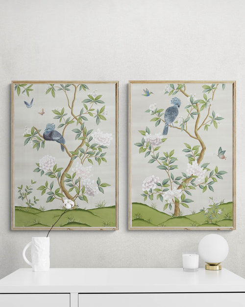 pair of two framed ivory and green botanical chinoiserie wall art prints with flowers and birds in Chinese painting style on wall