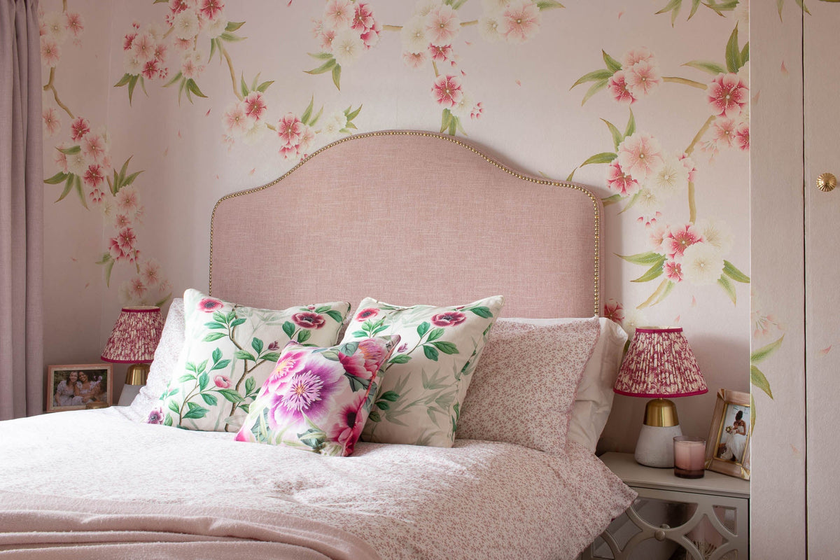 feminine bedroom featuring chinoiserie wallpaper and fabrics with flowers and plants