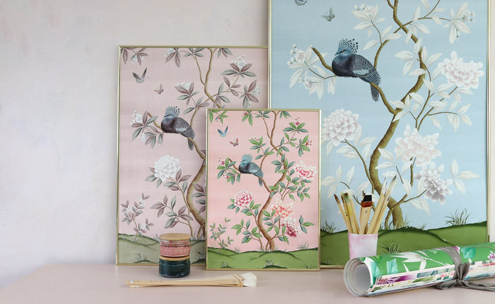Framed colourful chinoiserie art prints in art studio