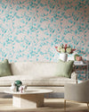 pink and blue botanical wallpaper featuring chinoiserie style fruits and flowers in modern living room