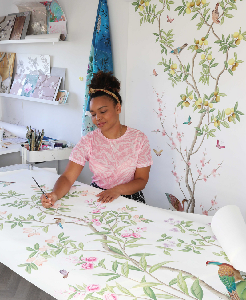 Diane Hill's painting the original design for her 'Chinoiserie Chic' wallpaper in collaboration with Rebel Walls