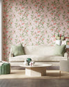 pink chinoiserie wallpaper featuring botanical birds, branches, and butterflies in modern grandmillennial style living room