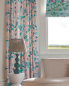 pink and blue botanical fabric featuring chinoiserie style fruits and flowers on curtains