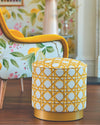 yellow geometric fabric featuring chinoiserie trellis design on footstool