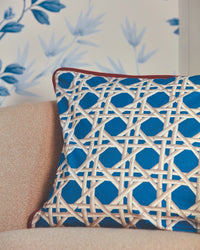 blue geometric fabric featuring chinoiserie trellis design on cushion