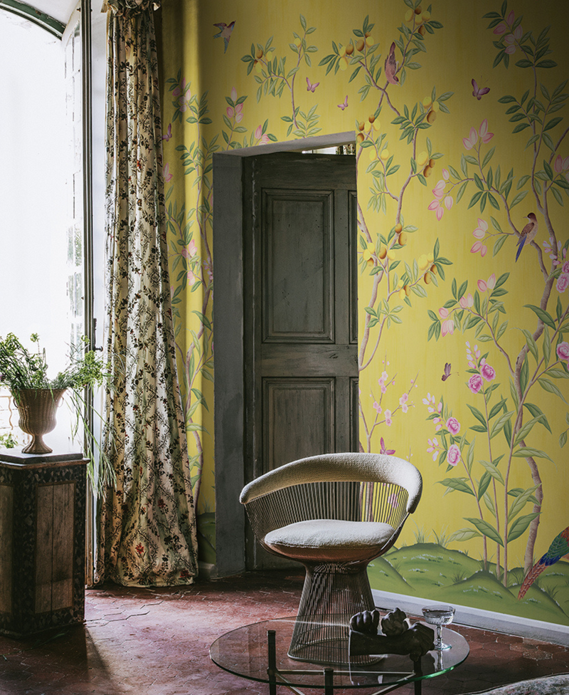 'Chinoiserie Chic, Saffron' chinoiserie wallpaper by Diane Hill for Rebel Walls in a living room lifestyle photo