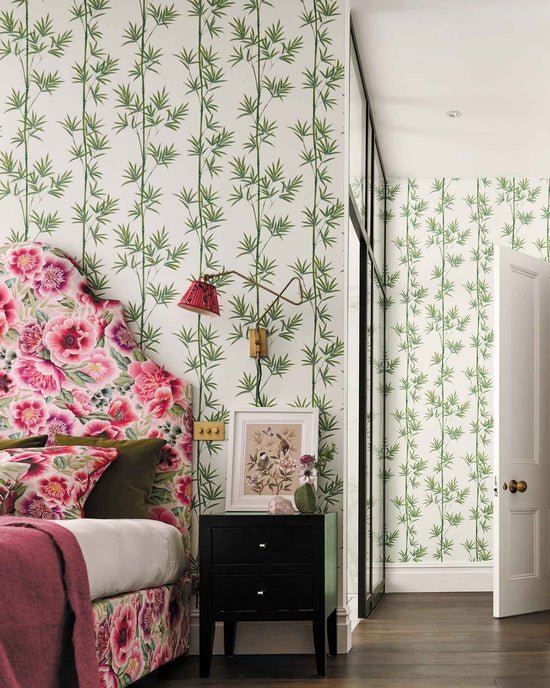 white and green botanical wallpaper featuring chinoiserie style bamboo in maximalist bedroom