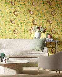 yellow botanical wallpaper featuring chinoiserie style animals and fruit in modern living room