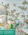 blue classic chinoiserie wallpaper featuring chinese illustration style peacocks, birds, and botanicals in maximalist bedroom