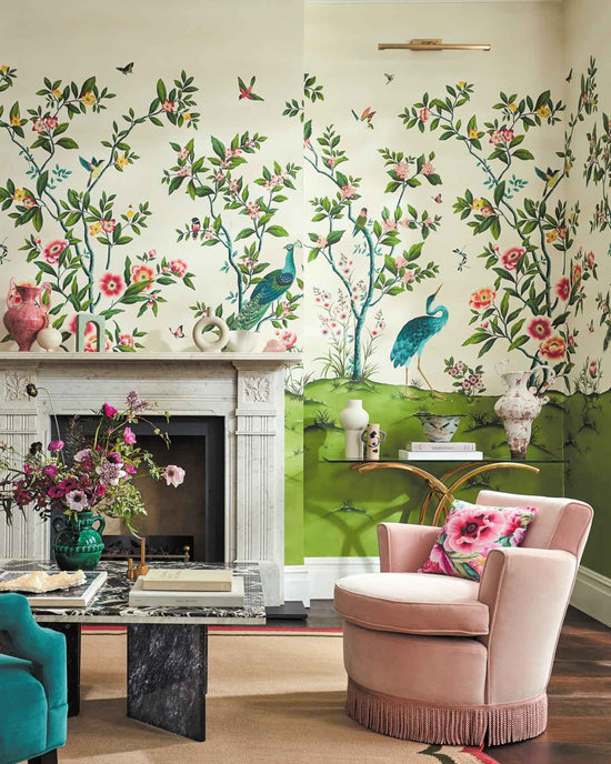 classic chinoiserie wallpaper featuring chinese illustration style peacocks, birds, and botanicals in grandmillennial style living room