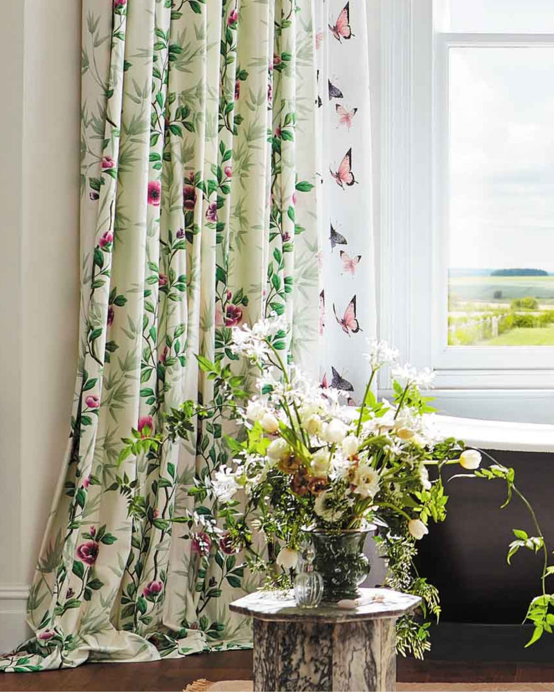 white and green floral fabric featuring chinoiserie style bamboo and flowers on curtains