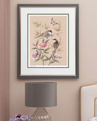 blush pink framed chinoiserie wall art print featuring vintage style birds, butterfly and flower branches with a bamboo background