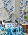 classic blue and white chinoiserie wallpaper featuring bamboo and flowers in regency style bedroom