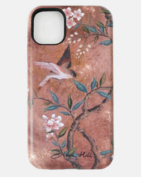 luxury chinoiserie phone case featuring vintage inspired bird branches and flowers on a distressed mottled background