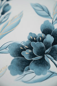 close up of regencycore style classic blue and white chinoiserie art print featuring flowers and branches with gold embellishment